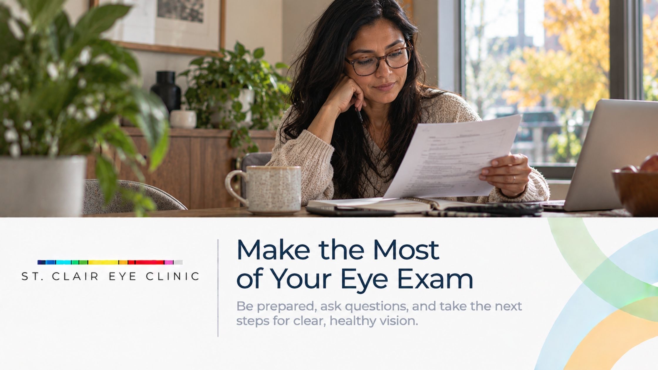 Woman reviewing paperwork at home while preparing for an upcoming eye exam.