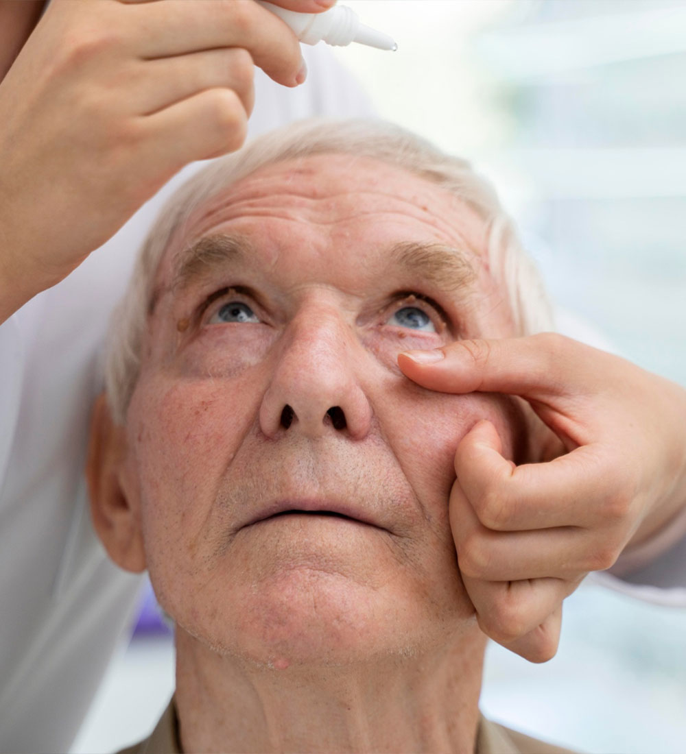 Doctor pouring some eye drops for a patient